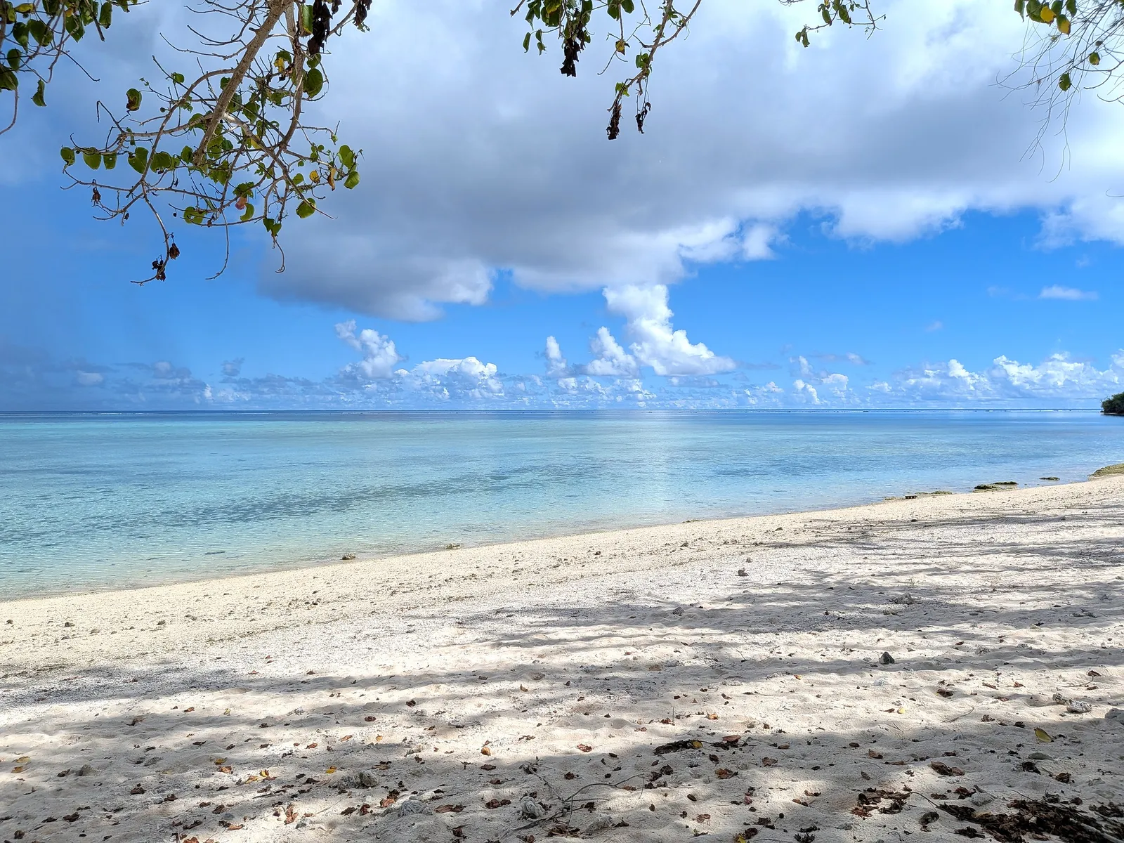 Open water view from Paupau Beach with the reef line visible on the horizon