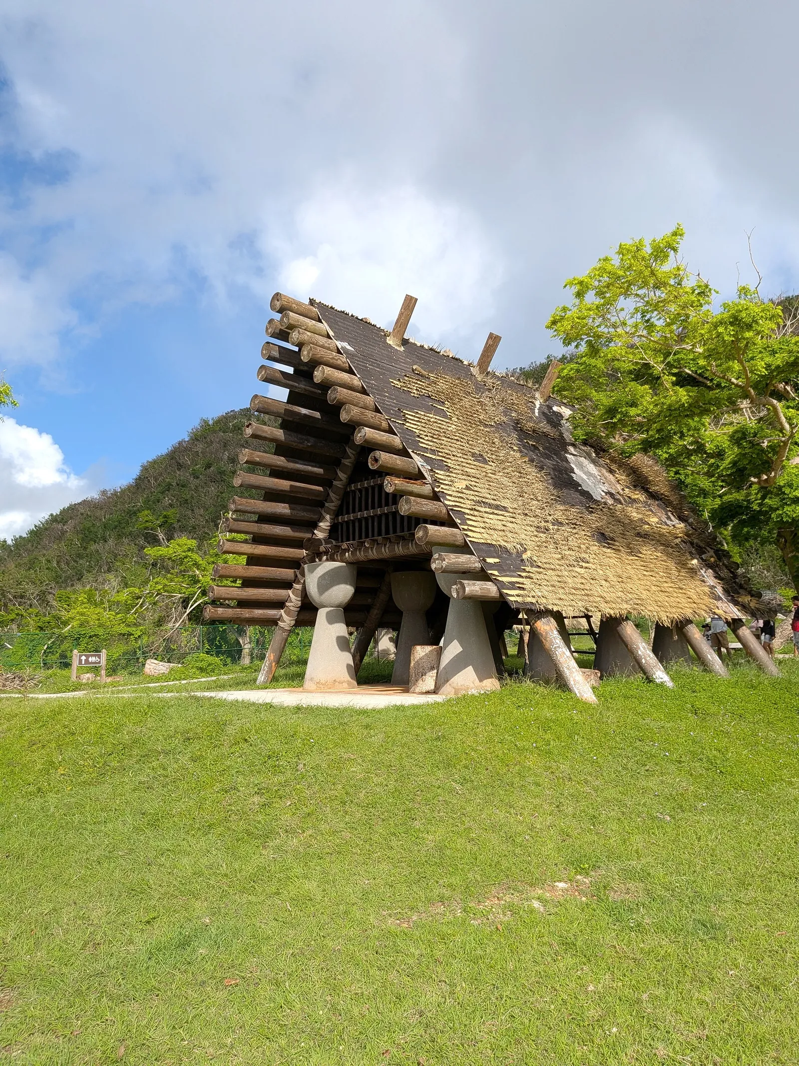 The replica ancient CHamoru latte hut at Kalabera Cave, a thatched timber house raised on latte stone pillars